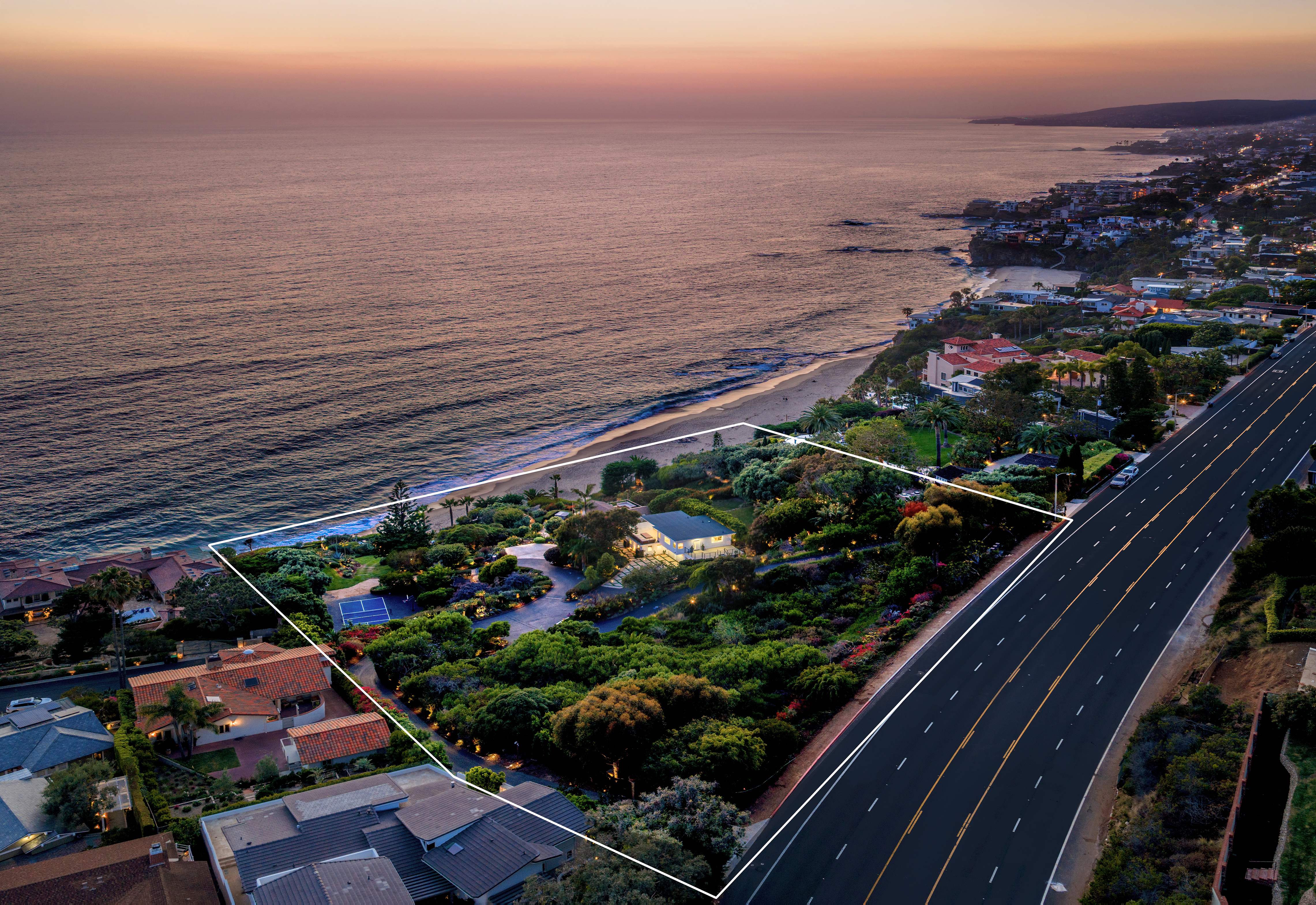 Aerial drone panorama at sunset showing property boundary